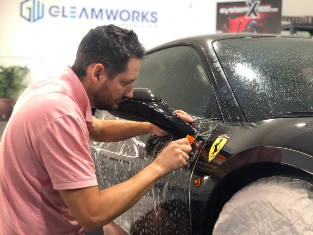 timur owner of gleamworks apply ppf on ferrari in vancouver